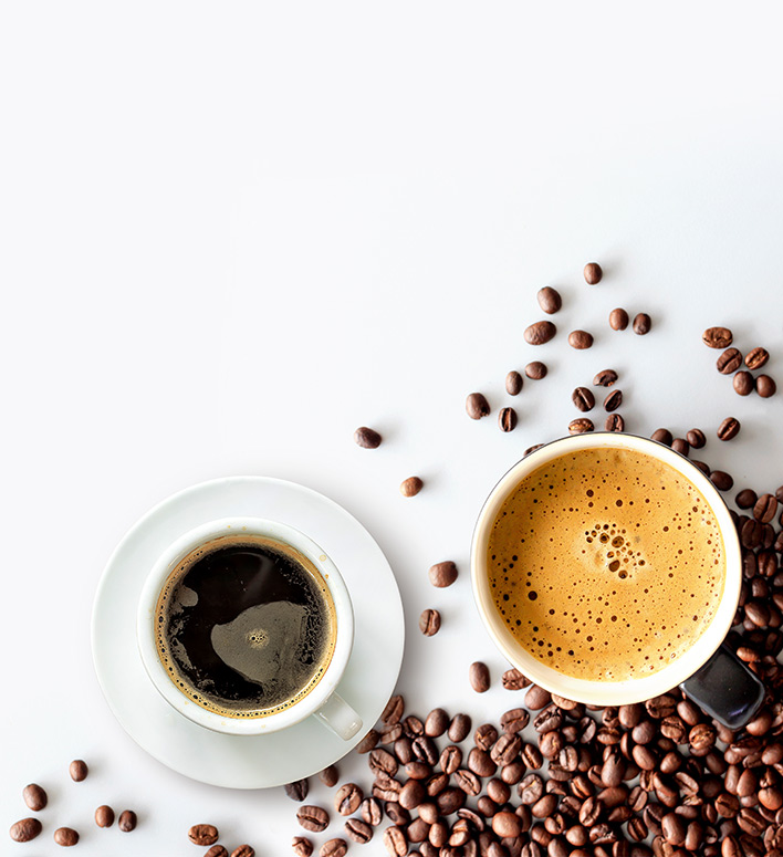 hot espresso and coffee bean on white table with soft-focus and